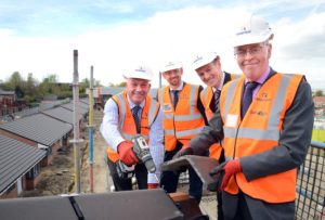 Bill Midgley with representatives from Keepmoat on top of Lawson House